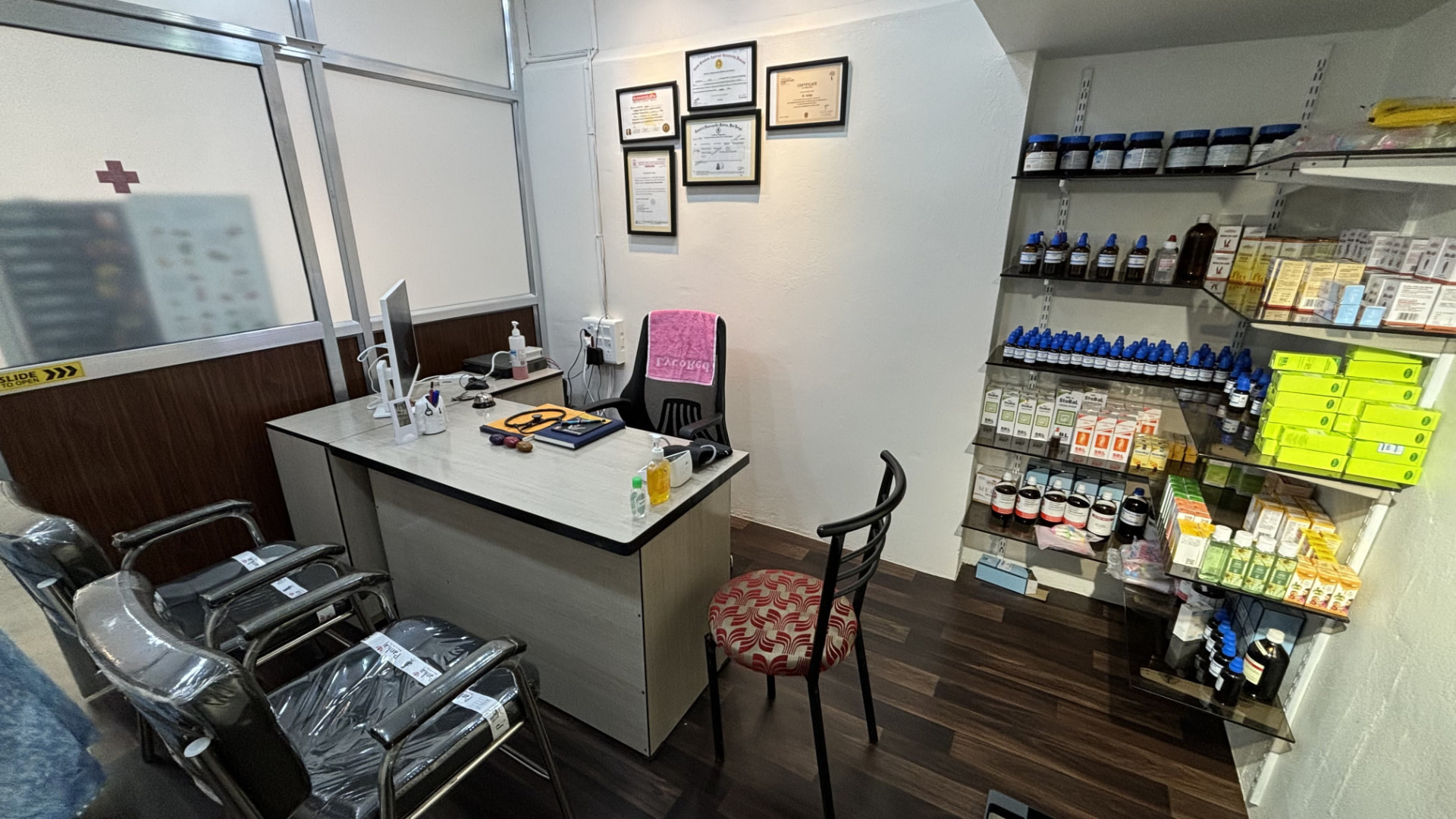 Doctor's desk and homoeopathic medicine shelves